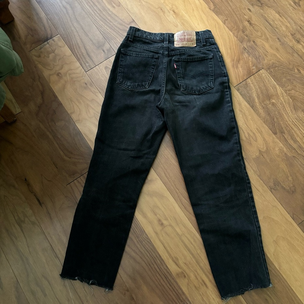 Vintage Levi's 512 black jeans, straight/tapered fit with a raw hem
